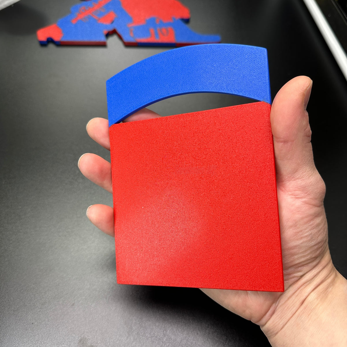 82nd Airborne Division display insignia in hand, featuring red and blue colors, 3D-printed design.
