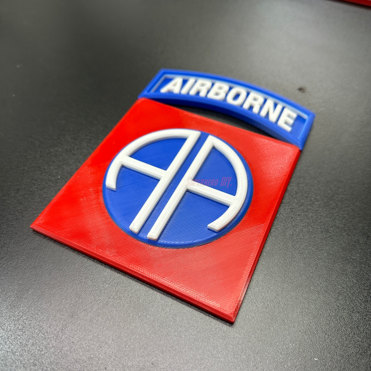 82nd Airborne Division display insignia in 3D print, featuring the iconic AA symbol on a red background.