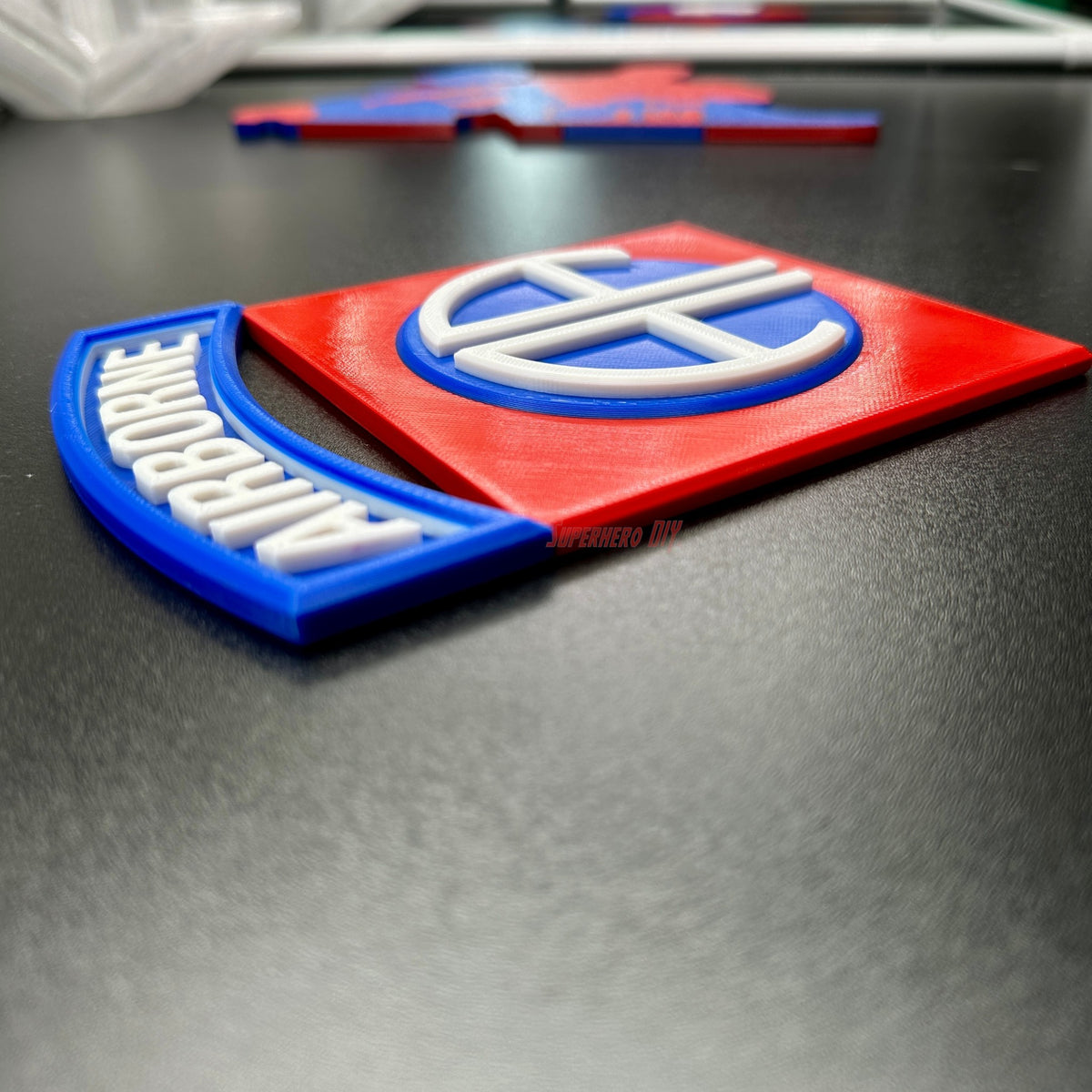 82nd Airborne Division display insignia in 3D print, vibrant red and blue design, showcasing military heritage.