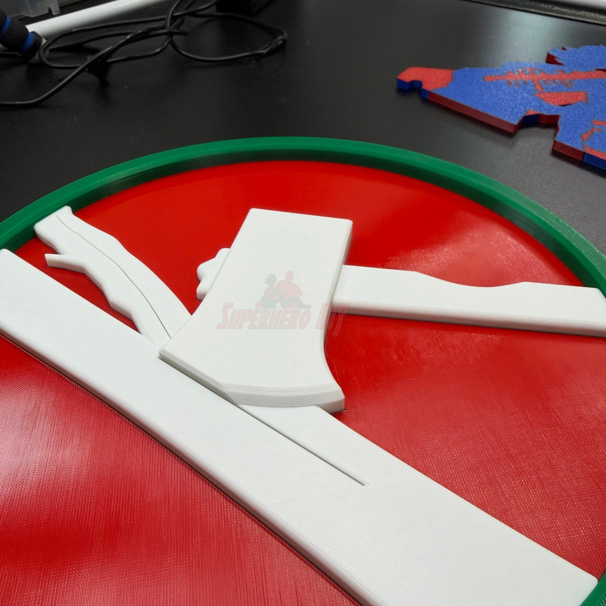 84th Training Command display insignia in layered relief with a white axe on a red field.