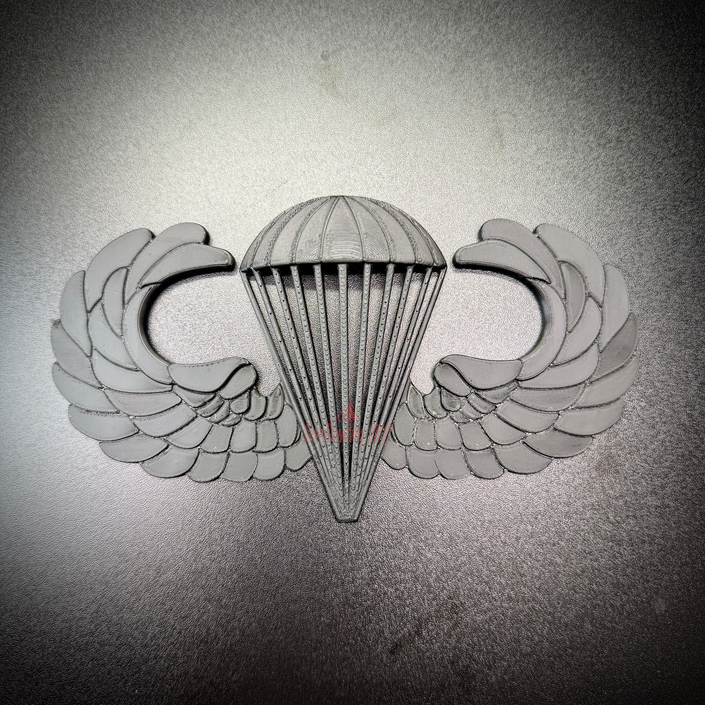 Model of airborne jump wings badge capturing the essence of military parachutist achievements.