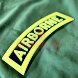 3D airborne tab displayed on a solid black background with bold yellow lettering.