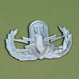 Replica EOD Badge Display on a green background showing technical skill and military achievement.