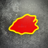 Flat back of the 25th ID taro leaf display insignia, red with a yellow edge, ready for adhesive strip mounting