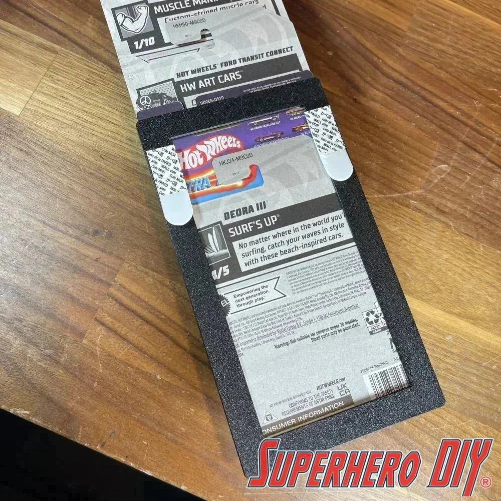 Display stand showing Hot Wheels wall display sleeve for 1:64 scale vehicles. Holds up to 5 cars. Features tabletop and wall mount options.