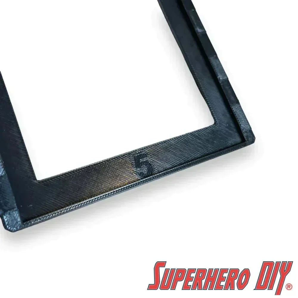 Close-up of black Hot Wheels wall display sleeve for 1:64 scale vehicle display, featuring Superhero DIY logo.
