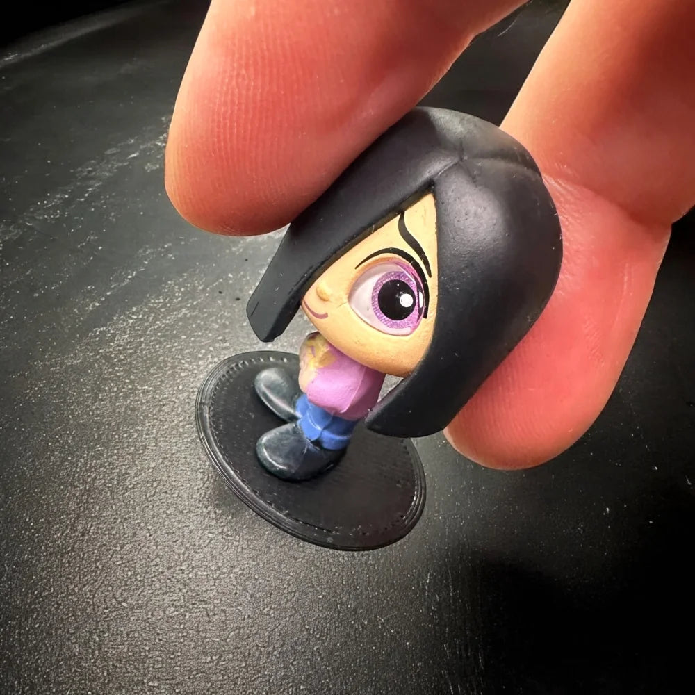 Display Stands for Disney Doorables Figures Peg Bases to Keep Standing with figure held by finger.