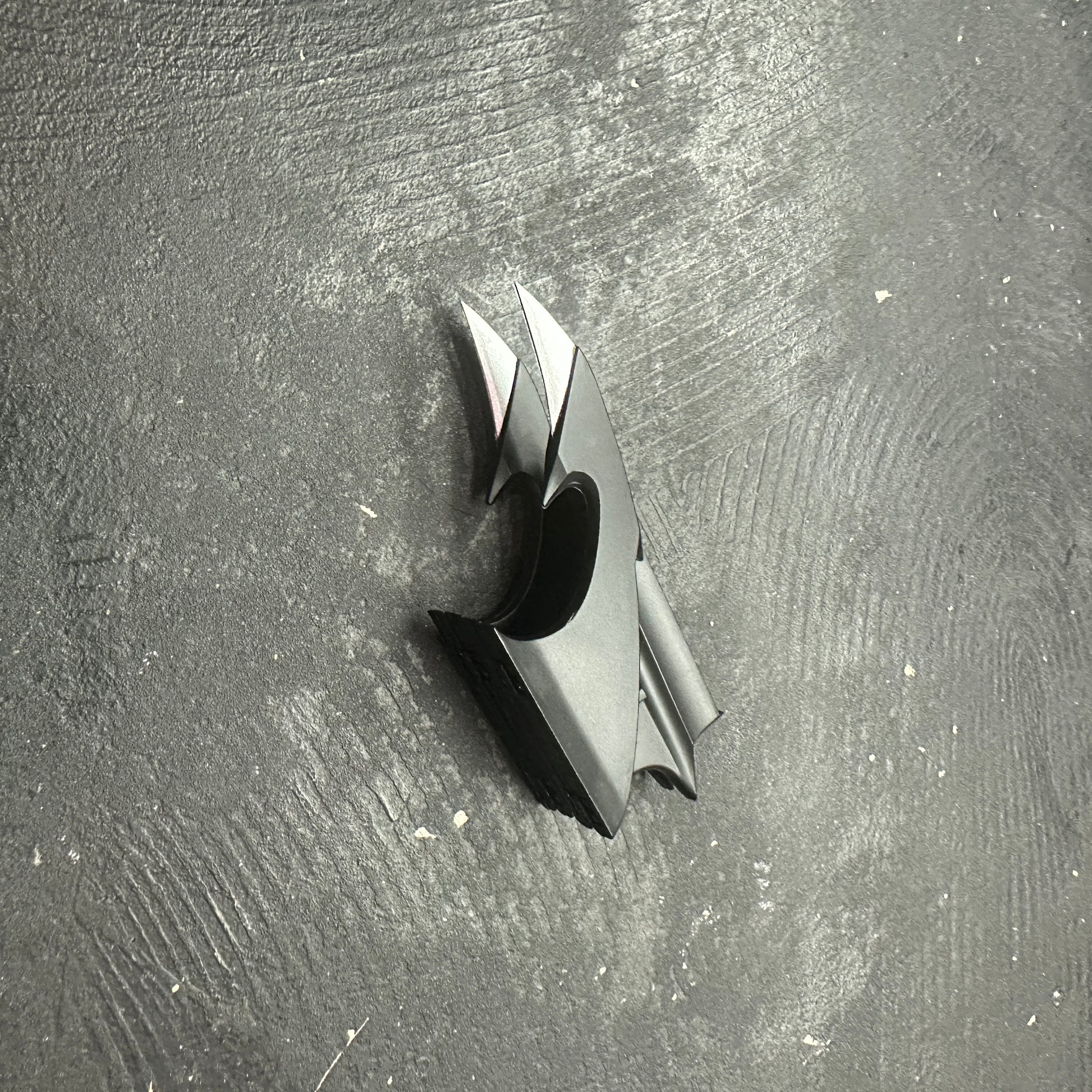 NECA BATMAN 1989 Folding Magnetic Batarang (LOOSE) displayed on a textured black surface.