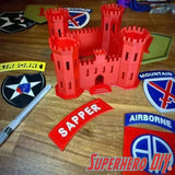 Engineer Corps Castle display with SAPPER tab and military patches on a wooden surface