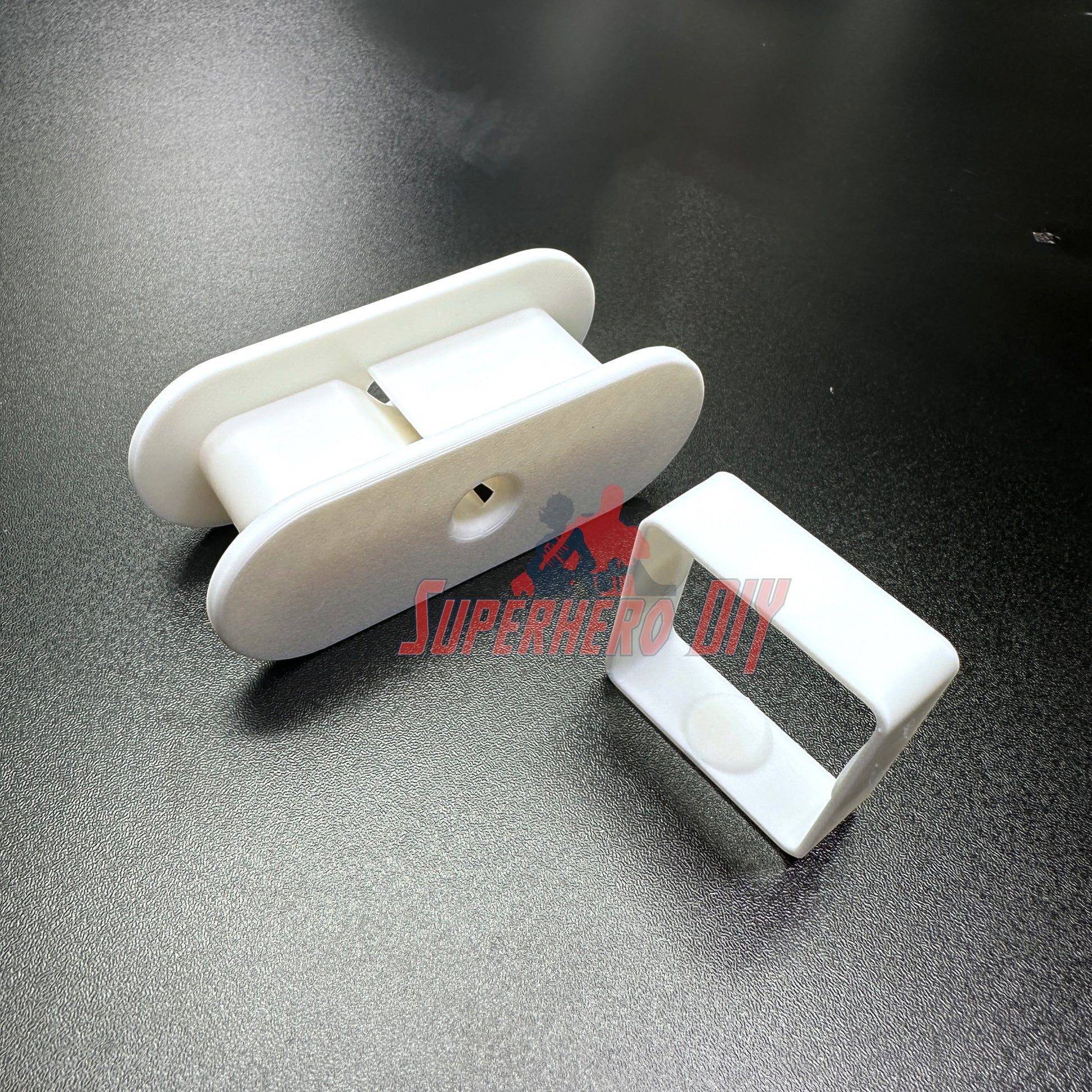 Fabric Tape Measure Holder | Snap-On Sewing Tape Storage for 60" or 145" Tailor’s Tapes | Plastic Sewing Tool for Quilters & DIY on a dark surface.