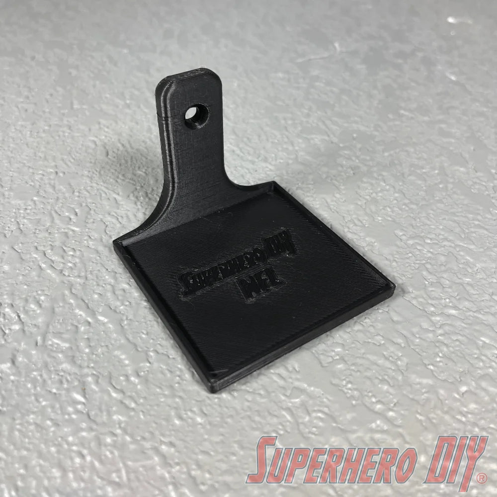 Black floating shelf with square base and vertical backplate with mounting hole. - SuperheroDIY