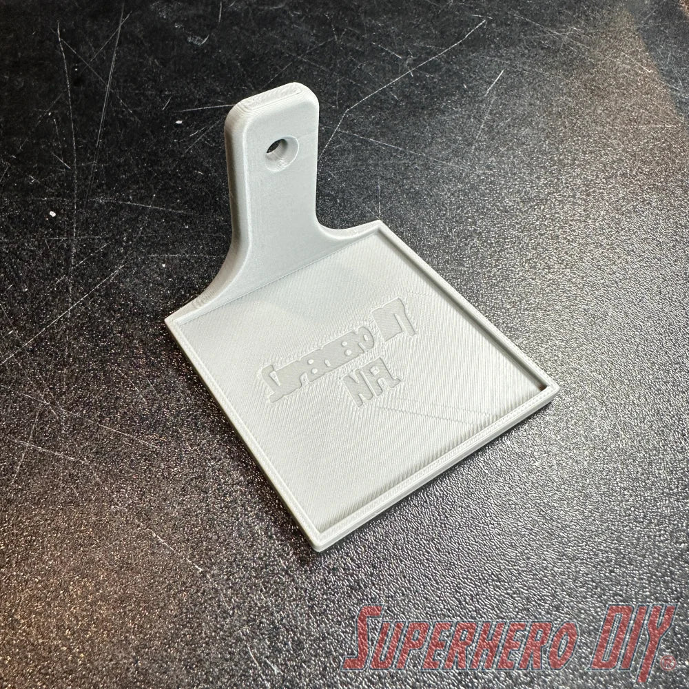 White floating shelf with square base and single keyhole mounting hole, branded NFL logo embossed. - SuperheroDIY