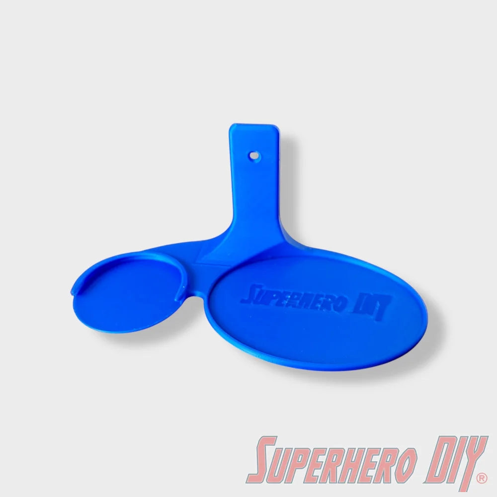 Blue floating shelf with two circular holders, one larger for Funko Pop and one smaller for Krypto figure, wall mountable. - SuperheroDIY