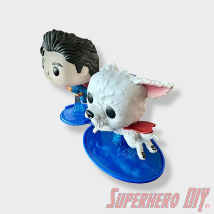 Blue floating shelf holding Superman and Krypto Funko Pop figures with clean edges. - SuperheroDIY