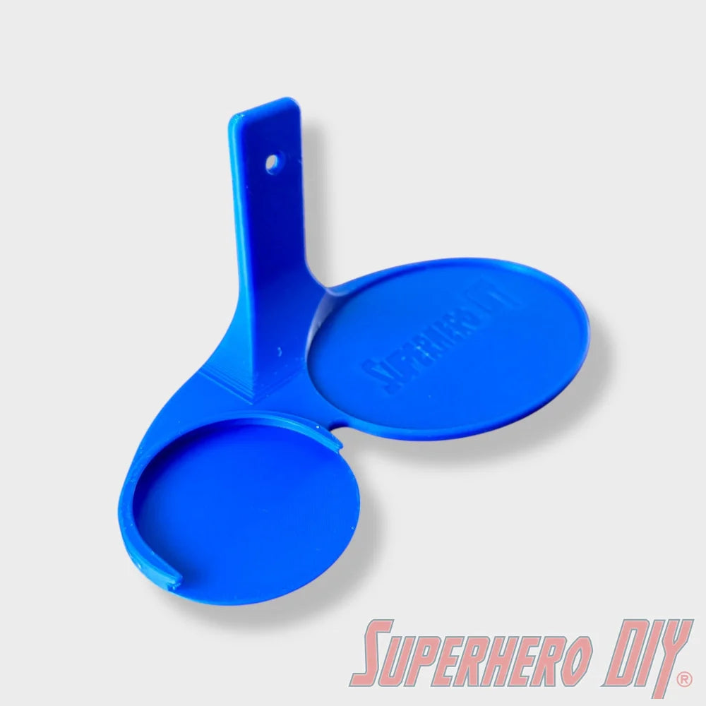 Blue floating shelf designed for two Funko Pop figures with one circular closed and one open slot. - SuperheroDIY