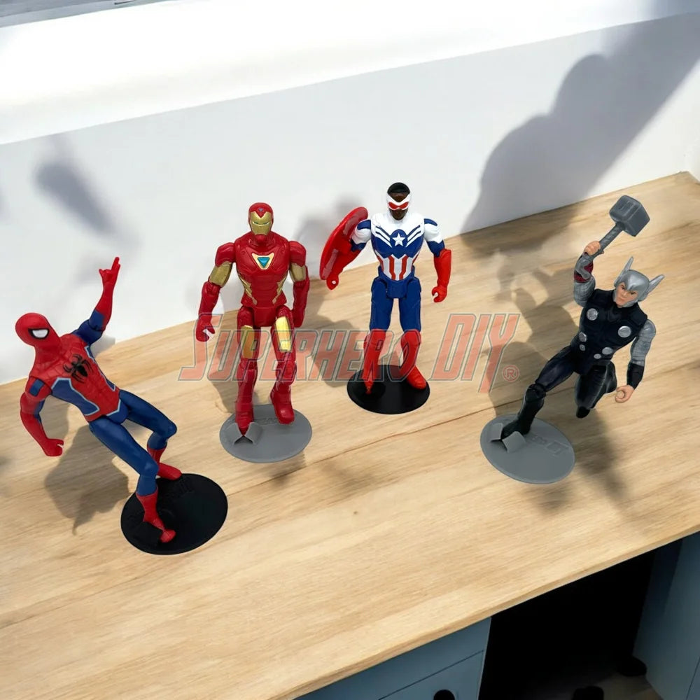 Foot Stands for 3.75-in to 4-in Action Figures displaying various superhero models on a wooden surface