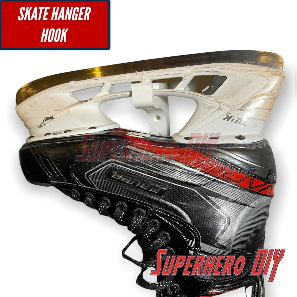 Close-up of a skate on a wall-mounted hockey gear organizer with a skate hanger hook.