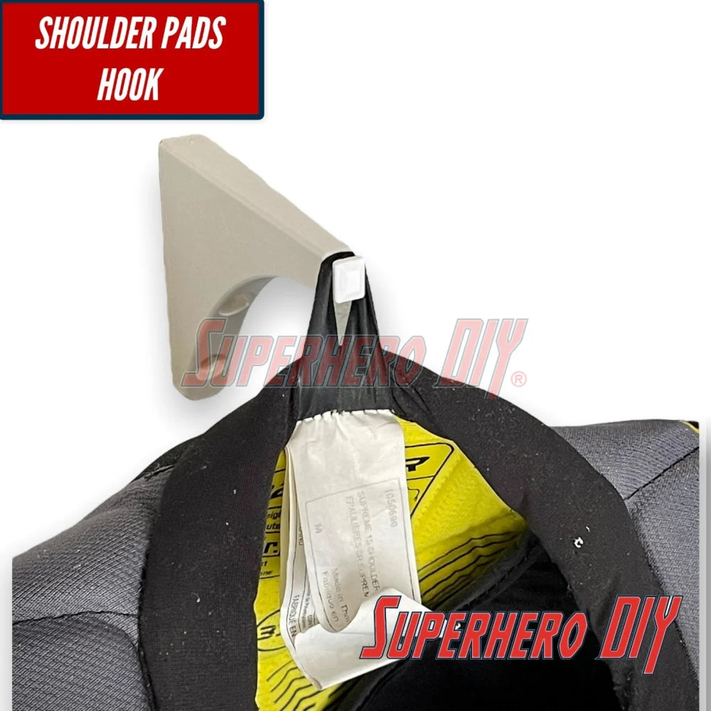 Shoulder pads hook for wall-mounted hockey gear organizer, ideal for keeping equipment organized and accessible.