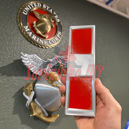 USMC Chief Warrant Officer rank insignia in silver and red, 3D-printed replica in hand, Marine Corps emblem in background