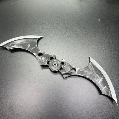 MAGNETIC Folding Arkham Batarang Cosplay Prop - 10" version with neodymium magnets, opened on black surface for display.
