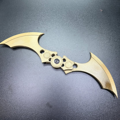 MAGNETIC Folding Arkham Batarang Cosplay Prop - 10" version on display, highlighting its intricate design and metal finish.