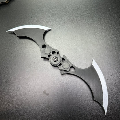 MAGNETIC Folding Arkham Batarang Cosplay Prop - 10" version shown open on a matte surface, highlighting intricate design and sharp edges.