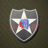 3D-printed 2nd Infantry Division display insignia patch on textured background.