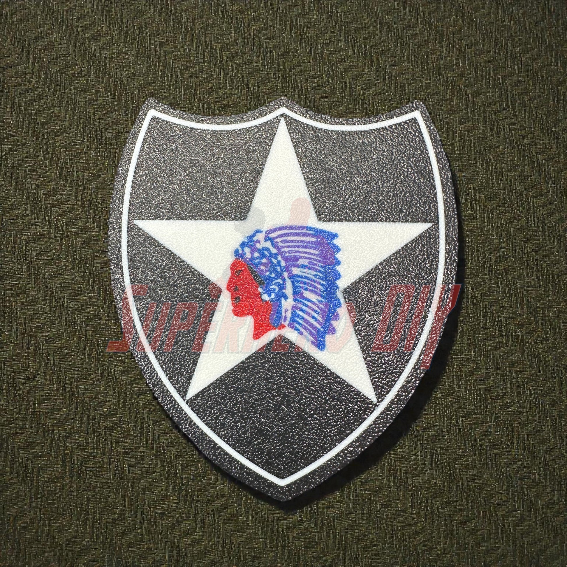 3D-printed 2nd Infantry Division display insignia patch on textured background.