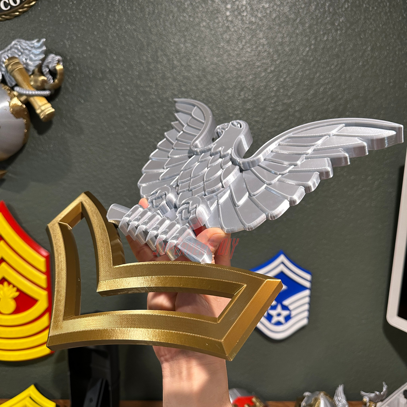 Navy enlisted rate insignia displaying silver eagle and gold chevron for military collection or display.