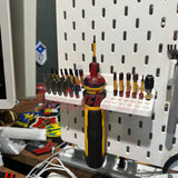 DeWalt cordless screwdriver organizer on wall with tools neatly arranged, featuring bits for DeWalt DWHT66719 cordless screwdriver.