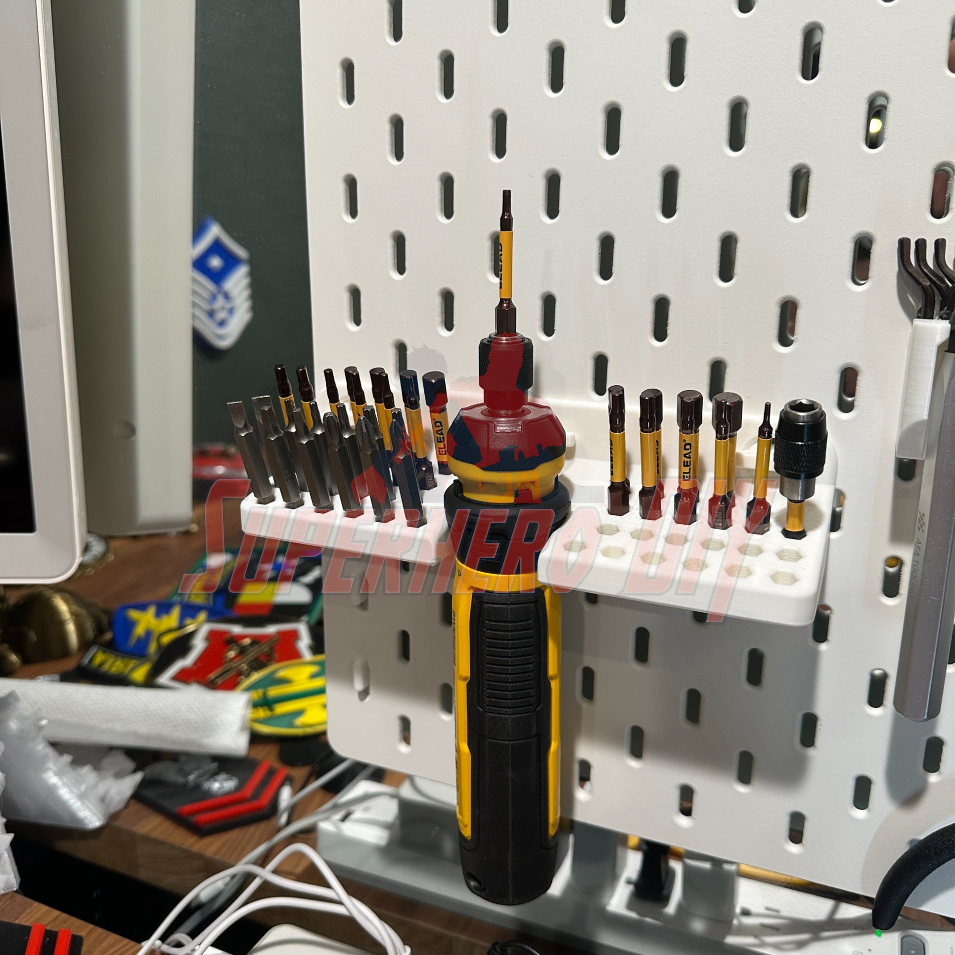 DeWalt cordless screwdriver organizer on wall with tools neatly arranged, featuring bits for DeWalt DWHT66719 cordless screwdriver.