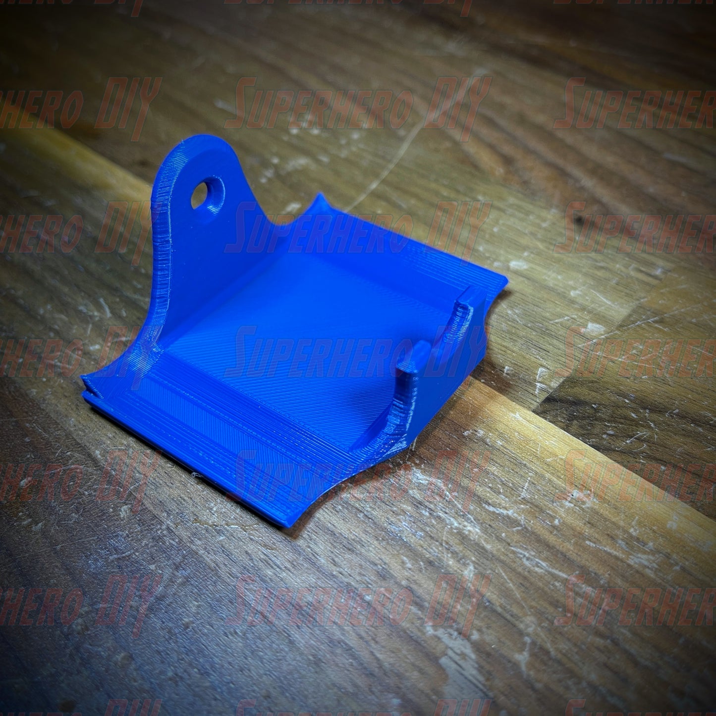 Blue PS4 controller wall mount for DualShock featuring a secure fit and command strip for easy installation.