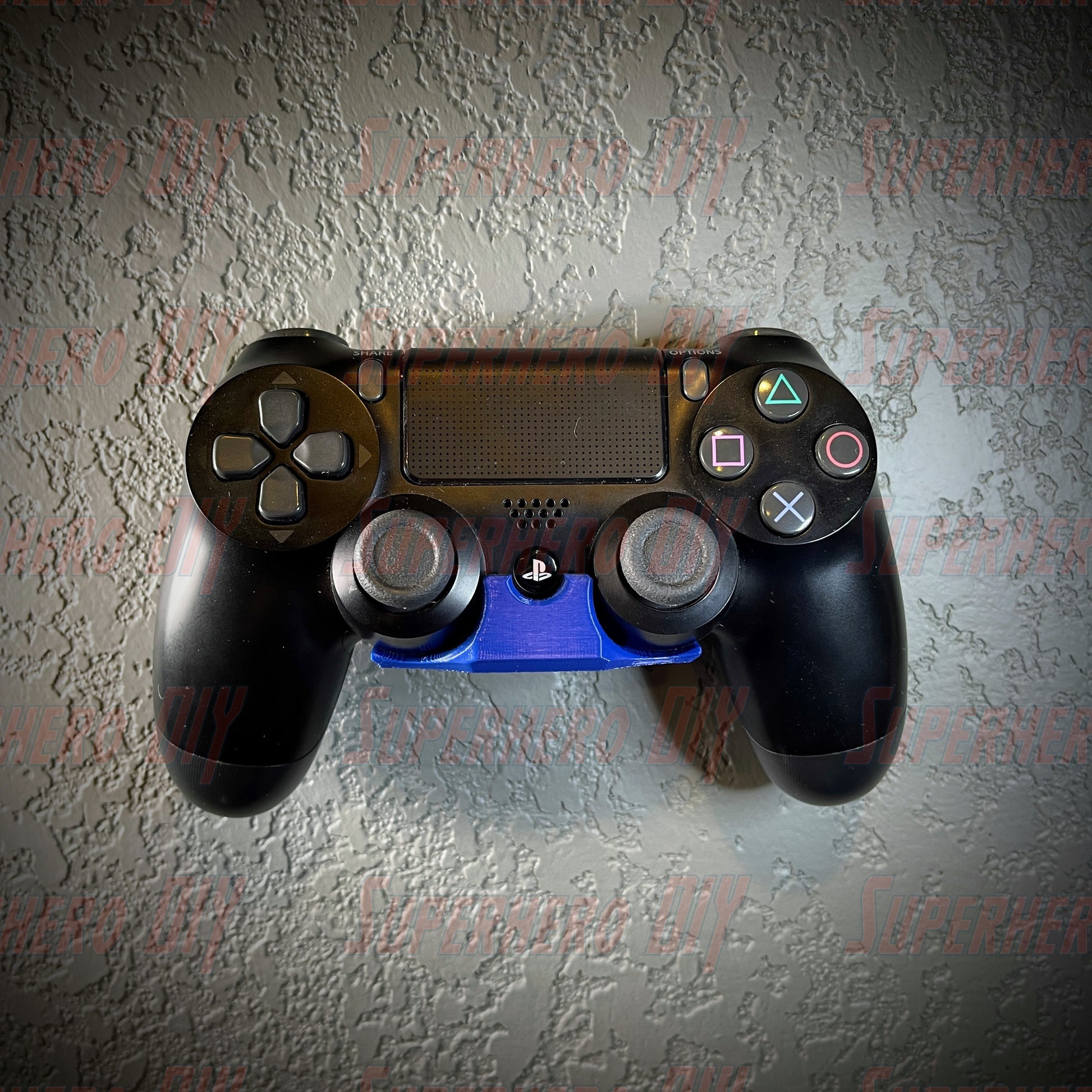 PS4 controller wall mount holding a DualShock 4 controller, includes command strip for easy installation