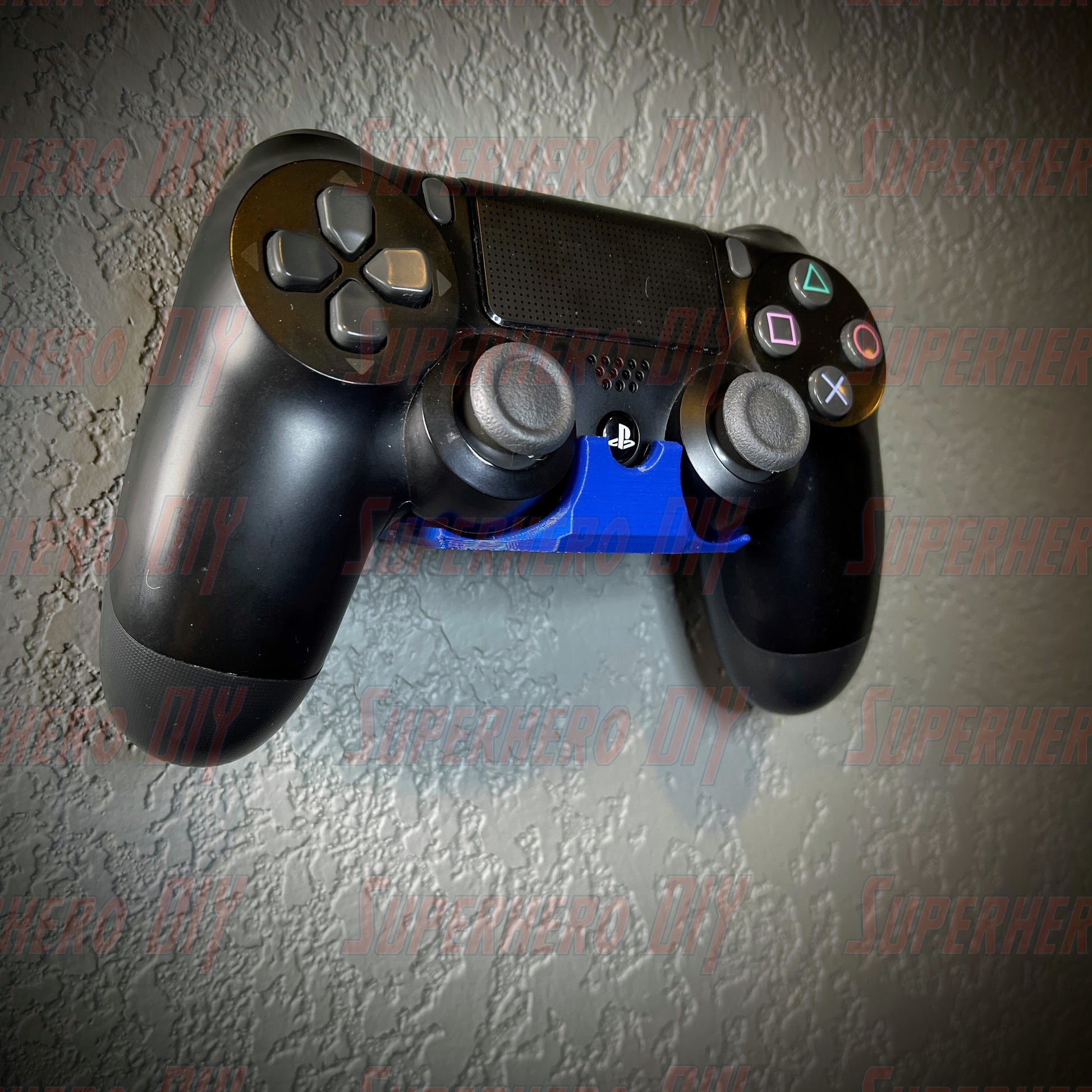 PS4 controller wall mount holding a black DualShock controller to keep it organized and easily accessible