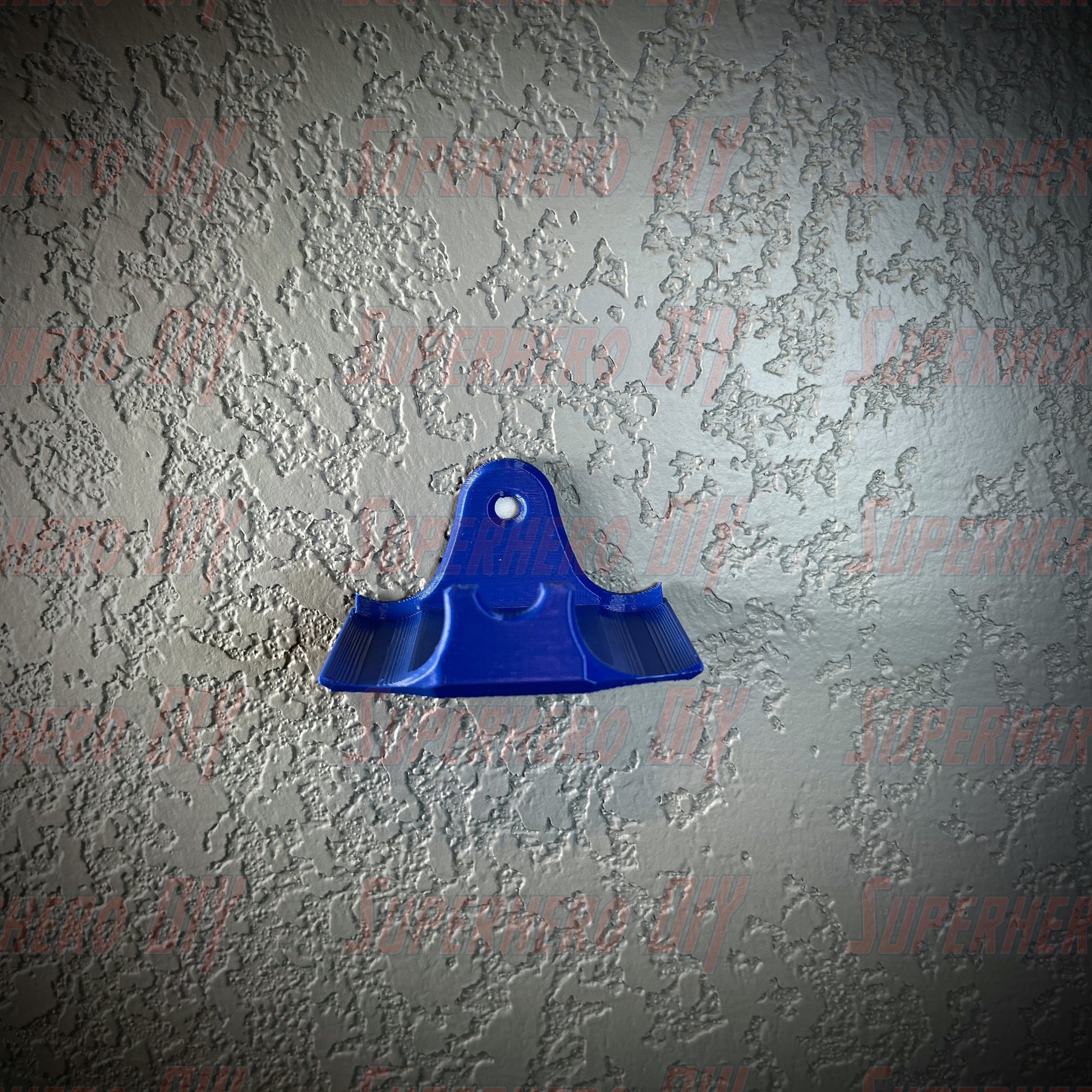 Blue PS4 controller wall mount for DualShock, attached to wall, includes command strip