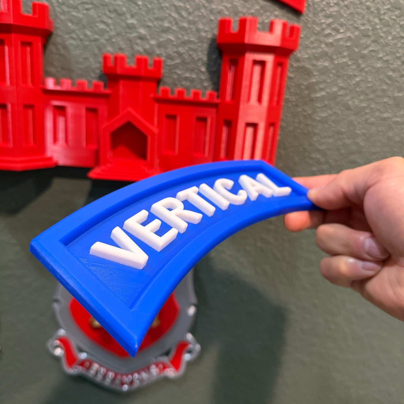 3D vertical construction engineer tab in blue with the word 'VERTICAL' displayed prominently.