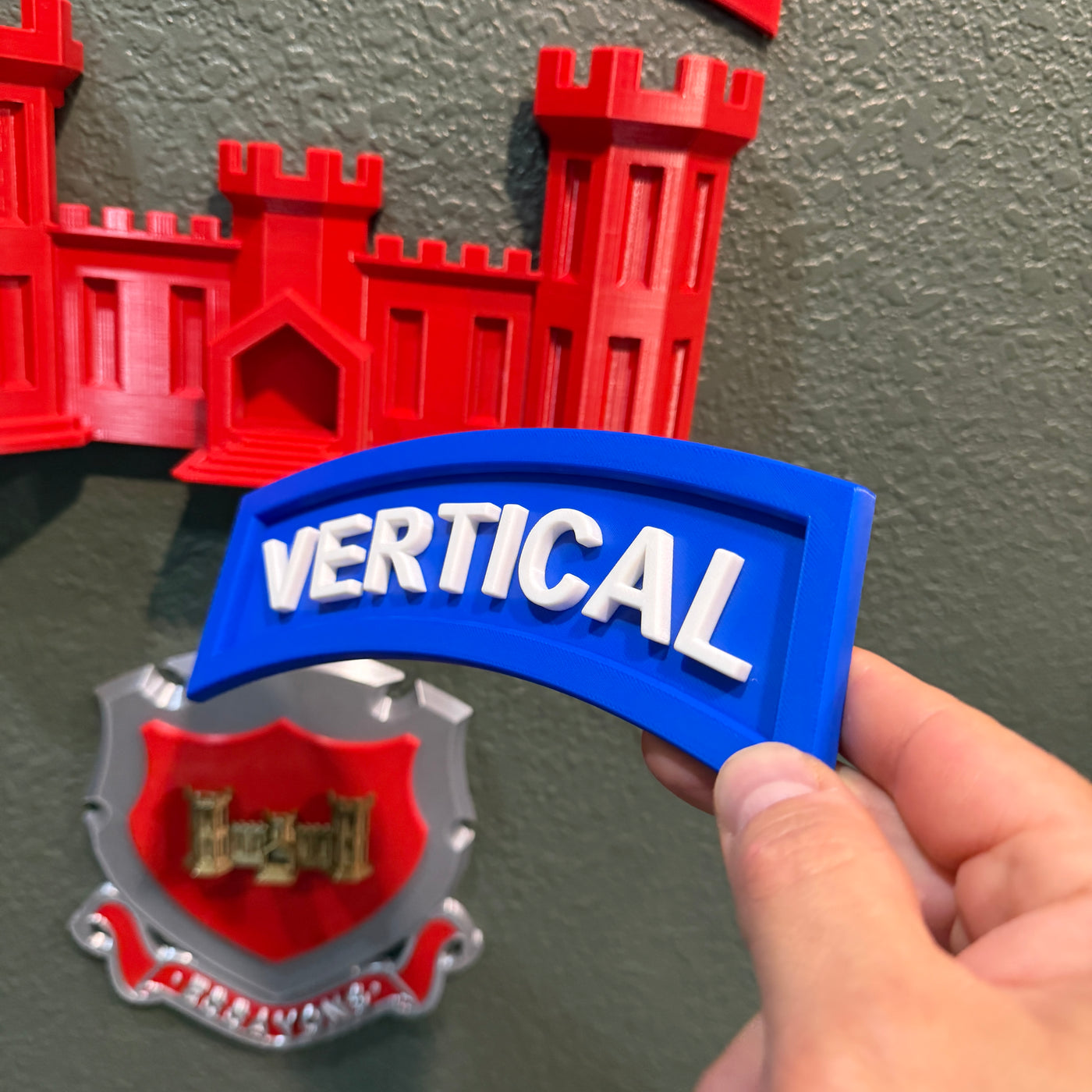 3D vertical construction engineer tab featuring a blue and white 'VERTICAL' component against a decorative background.