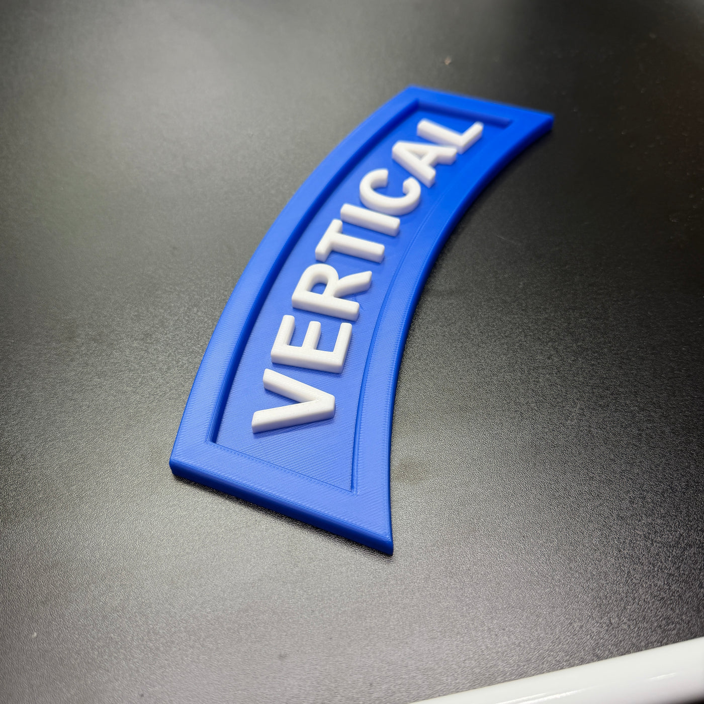 3D vertical construction engineer tab in blue with the word 'VERTICAL' prominently displayed