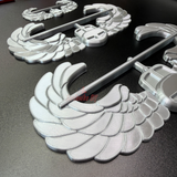 Air Assault Badge display insignia components in shiny silver finish on a black surface.