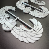 Air Assault Badge display insignia featuring shiny silver wings and helmet, ideal for military badge showcases.