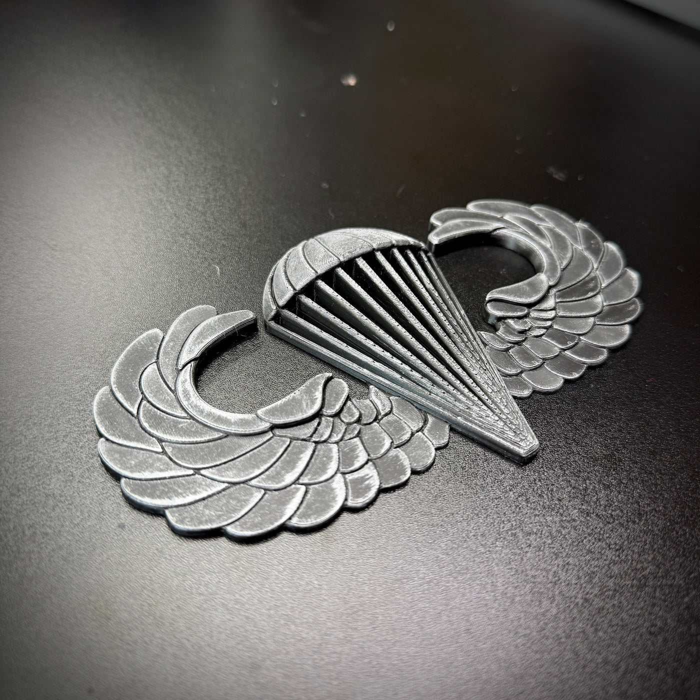 Airborne badge jump wings insignia showcasing detailed design for collectors and veterans.