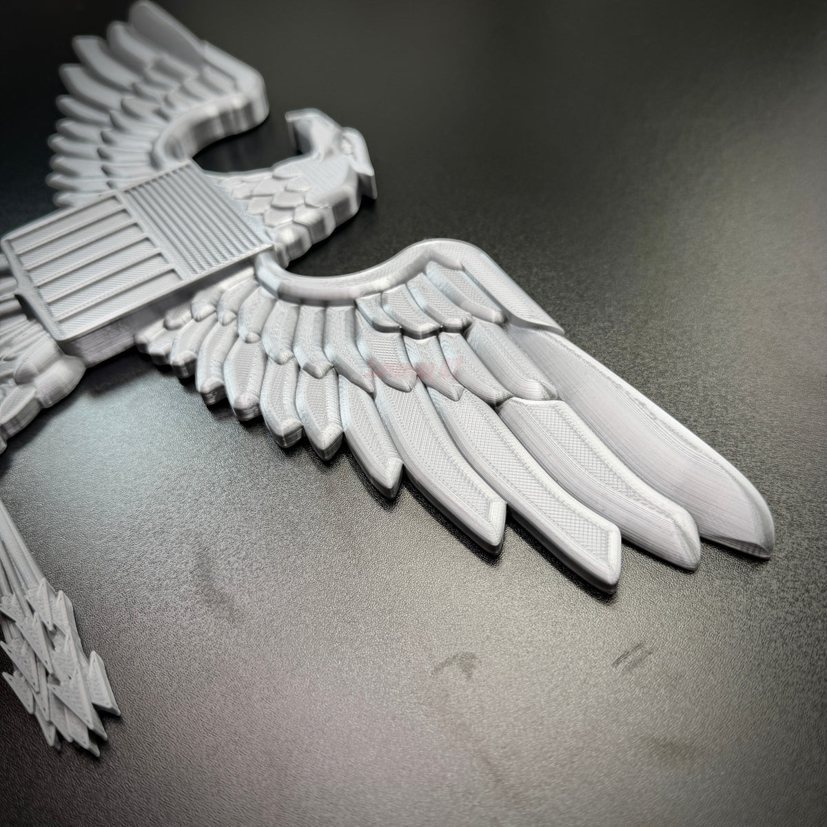 Detail of Colonel Captain rank insignia O-6 with eagle and wings, showcasing quality craftsmanship and design.