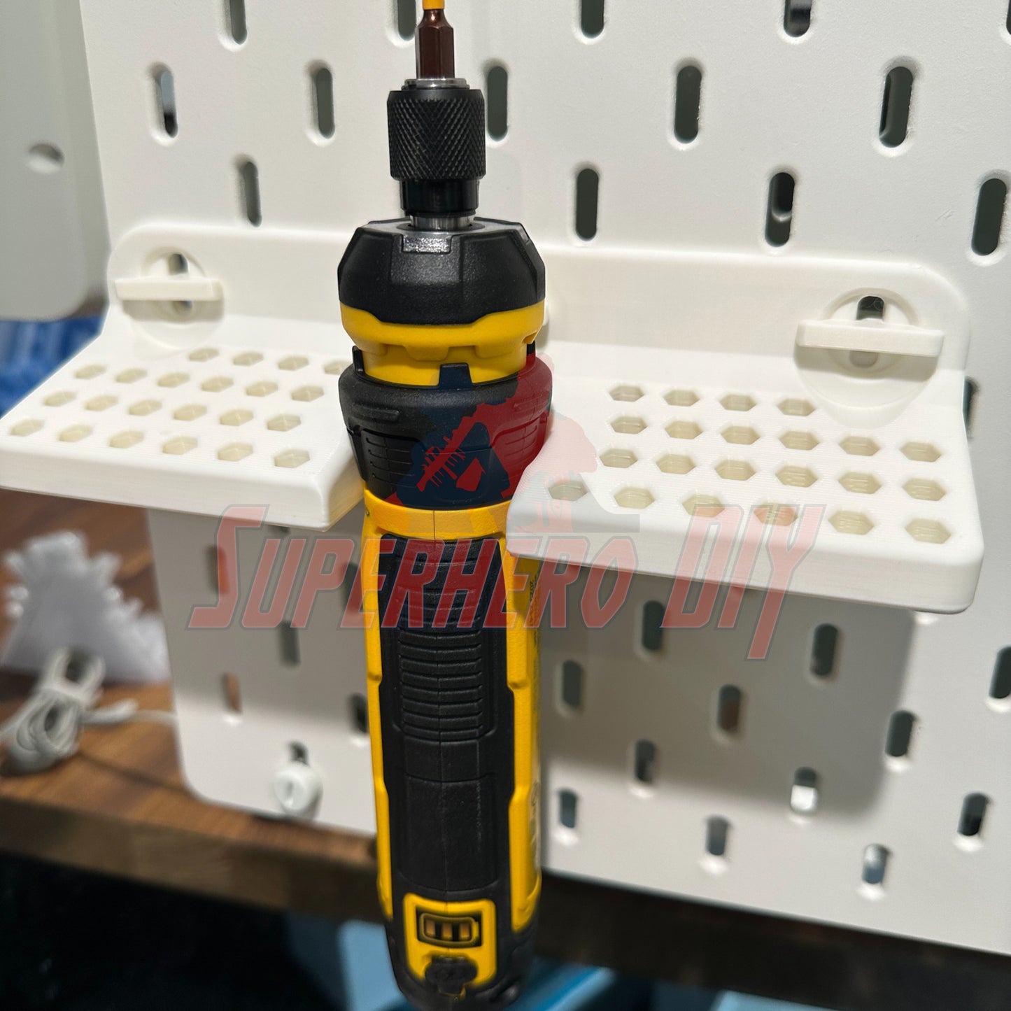 DeWalt cordless screwdriver organizer mounted on wall with T-Lock holding a DWHT66719 cordless screwdriver for quick tool access.