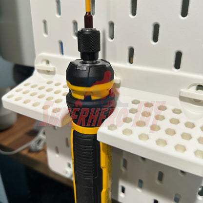 Close-up of DeWalt cordless screwdriver organizer on wall, holding a cordless screwdriver with attachments.