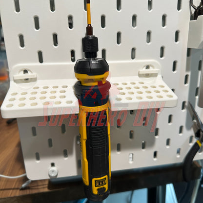 DeWalt cordless screwdriver organizer wall-mounted SKADIS with screwdriver attached for easy tool access.