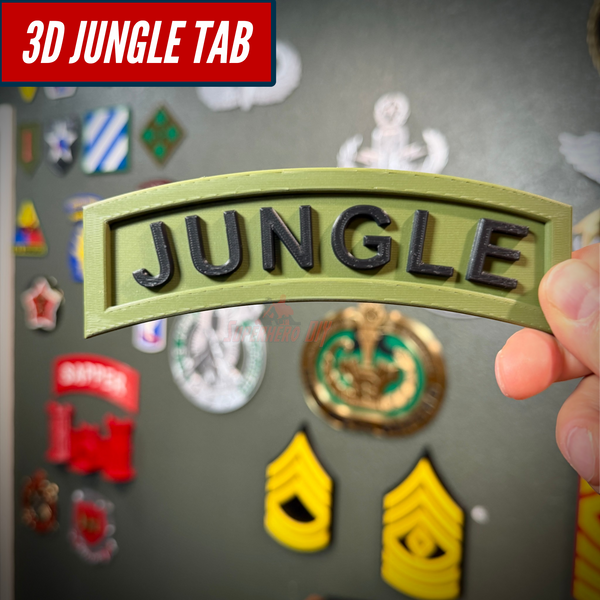 Close-up of a 3D jungle tab display piece with JUNGLE lettering on an army green background.