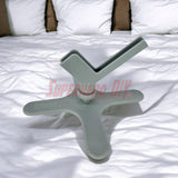 Bedside Kindle stand with stable base under pillow
