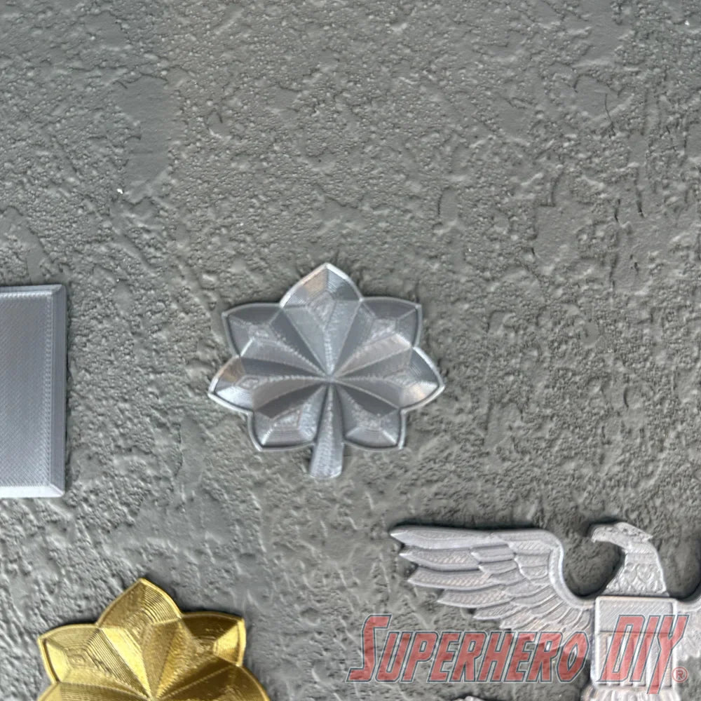 Lieutenant Colonel rank insignia in shiny silver finish on textured background, displaying O-5 military rank.