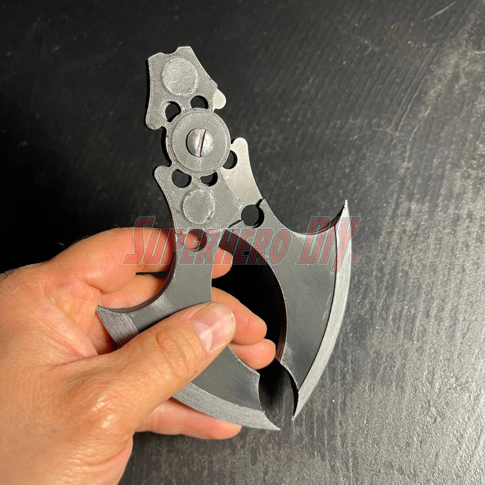 Hand holding MAGNETIC Folding Arkham Batarang Cosplay Prop - 10\" version with embedded magnets and sleek design.