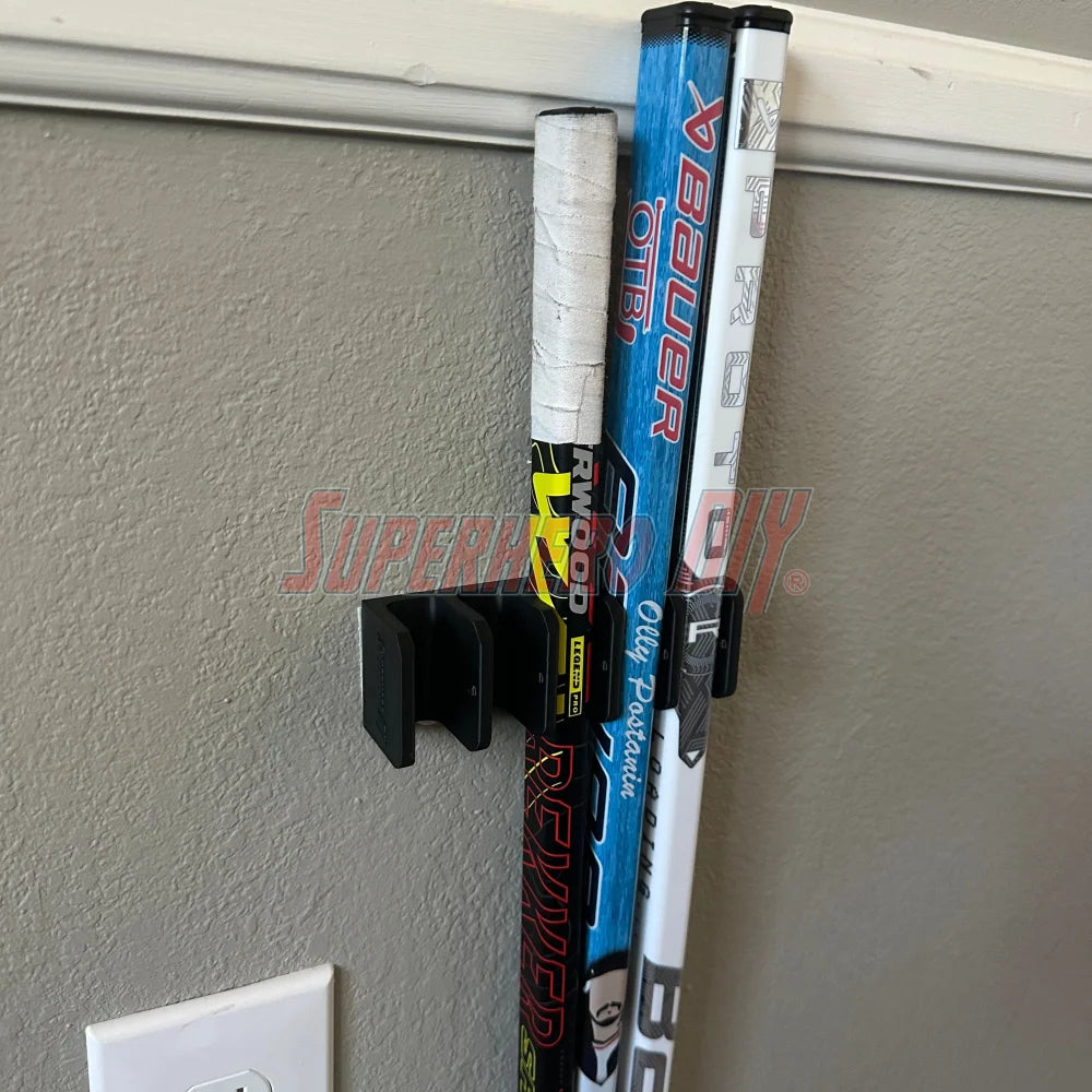 Mini stick holder wall mount for knee hockey sticks, organizing five to ten mini sticks efficiently on a wall.